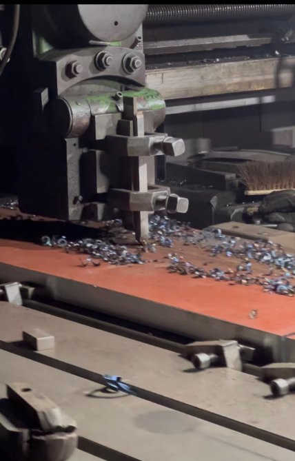 Fresh metal chips on the machine table during in-house machining at ZTGAOKE