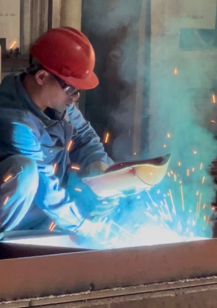 ZTGAOKE welder welding the press brake frame with sparks flying