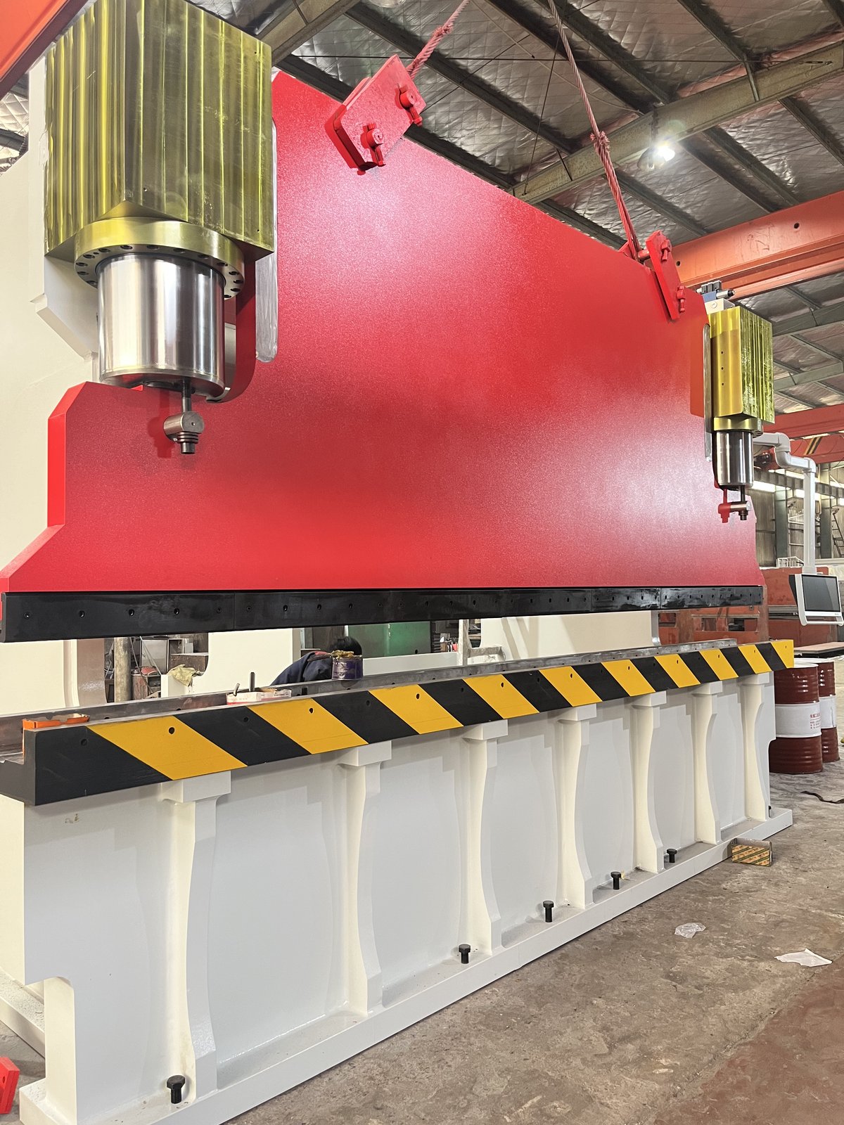 ZTGAOKE 600T 5000mm heavy-duty CNC press brake in assembly - red upper beam with safety guards